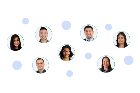 A diverse group of seven smiling employees or team members.