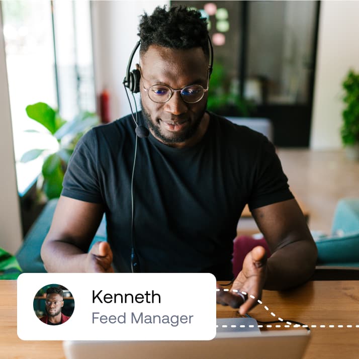 A support specialist named Kenneth wearing a headset, collaborating remotely via laptop with a "Feed Manager" badge.